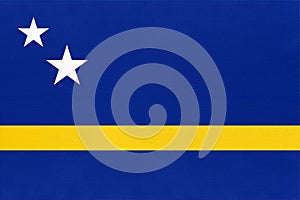 Curacao national fabric flag, textile background. American state official sign