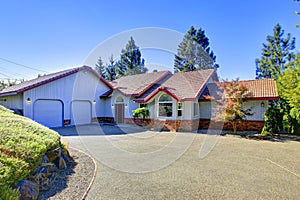 Curb appeal of blue house with brick trim