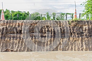 The curb erosion from storms. To indicate the layers of soil