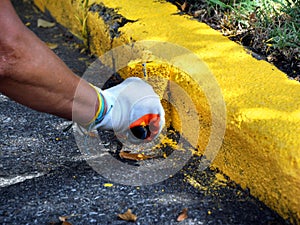 Curb Getting New Coat of Yellow