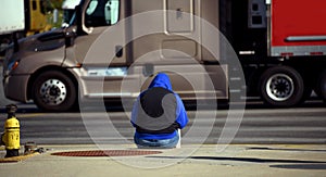 Curb Seat for Homeless Young Woman