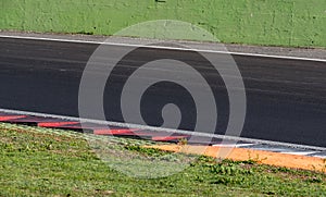 Curb and turn detail on motor racing circuit