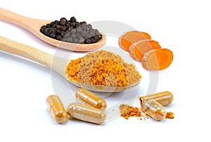 Curcuma capsules, Curcumin powder, Turmeric slices and black peppercorns