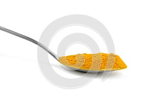 Curcuma powder in spoon isolated on white background. Turmeric spice
