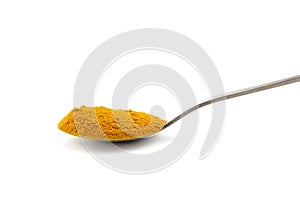 Curcuma powder in spoon isolated on white background. Turmeric spice