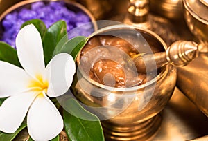 Curcuma and tamarine paste in golden container