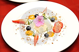 Curd dessert with berries on a plate