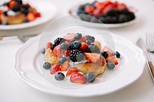 Curd fritters with berries