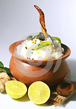 Curd rice in a clay pot with buttermilk chilly