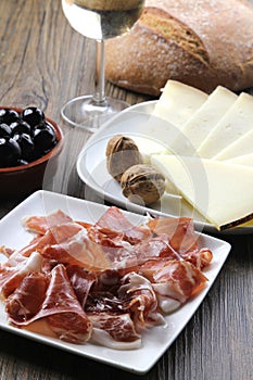 Cured iberian ham and cheese tapas