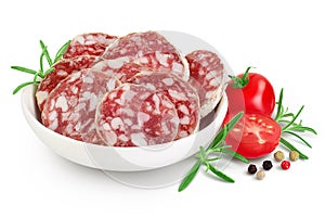 Cured salami sausage in ceramic bowl isolated on white background. Italian cuisine with full depth of field photo