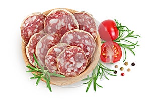 Cured salami sausage in wooden bowl isolated on white background. Italian cuisine with full depth of field. Top view photo