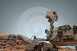 Curiosity Mars Rover exploring the surface of red planet.