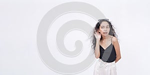 A curious asian woman wanting to listen on the latest gossip.Leaning forward to hear better. Isolated on a white background, with