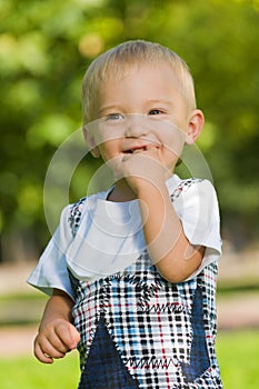 Curious baby boy in the park