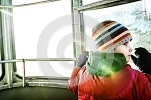 Curious boy in cable car