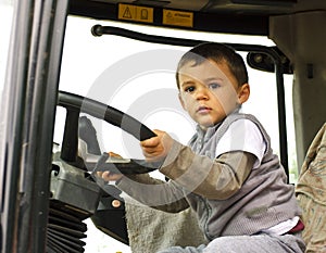Curious boy at the wheel