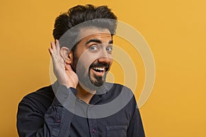 Curious Cheerful Indian Man Holding Hand Near Ear Trying To Overhear Something