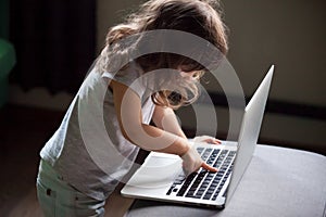 Curious girl using laptop, pc control security for kid concept