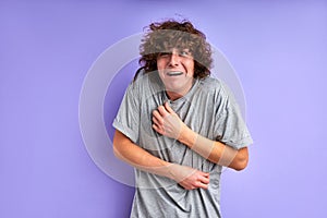 a curious gray rat crawling on a man's shoulders