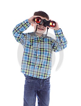 Curious little boy is looking through binoculars