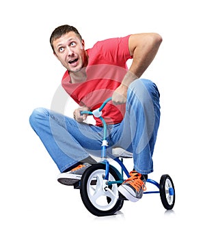 The curious man on a children's bicycle