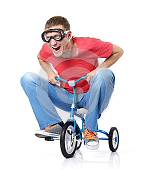 Curious man on a children's bicycle, on white