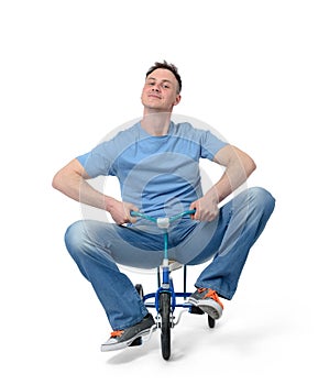 Curious man on a children's bicycle on white background