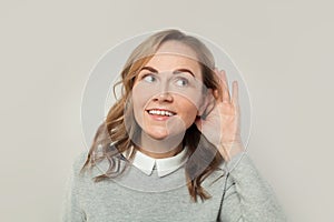 Curious nosy woman listening news and gossips on white