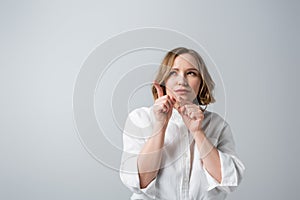 curious overweight woman in white shirt