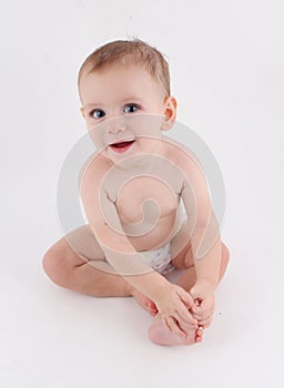 Curious silly funny baby sitting up