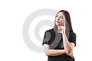 Curious thinking girl with expression face looks up. Cute puzzled woman in studio on isolated background. Place for your text