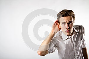 Curious young man in white