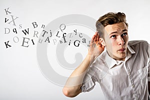 Curious young man in white. Curious man and letters. Information concept