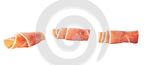 Curled Slices of Delicious Prosciutto isolated on white background.Meat or Ham slice, rolled up isolated on white background