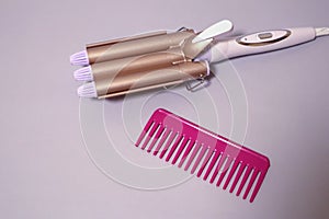 Curling iron for curls. Hair style. Hair care equipment.