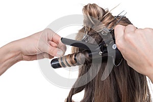 Curling iron and strand of hair in process