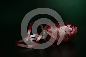 Curling Ribbon - Red gift wrapping band on black background