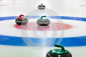 Curling stones on the ice