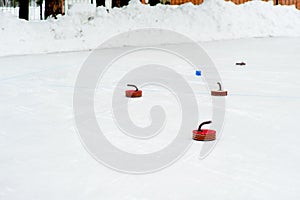 Curling stones on the ice