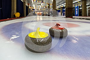 Curling stones on an indoor rink