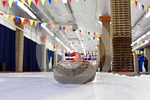 Curling stones on an indoor rink