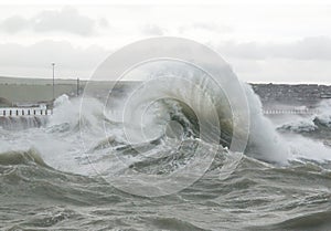 Curling Wave Spray at Newhaven Harbour photo