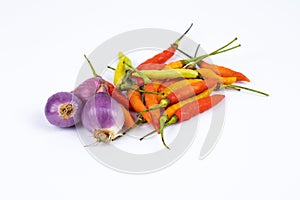 curly chili and red onion, shallots isolated on a white background