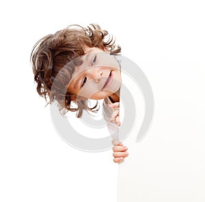 Curly funny child holding blank advertising