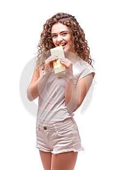 Curly girl eating white chocolate