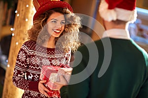 Curly girl exchanges gifts with boyfriends