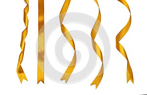 Curly golden ribbons on white background