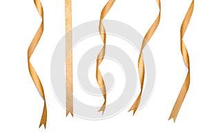 Curly golden ribbons on white background