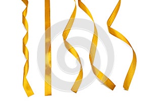 Curly golden ribbons on white background